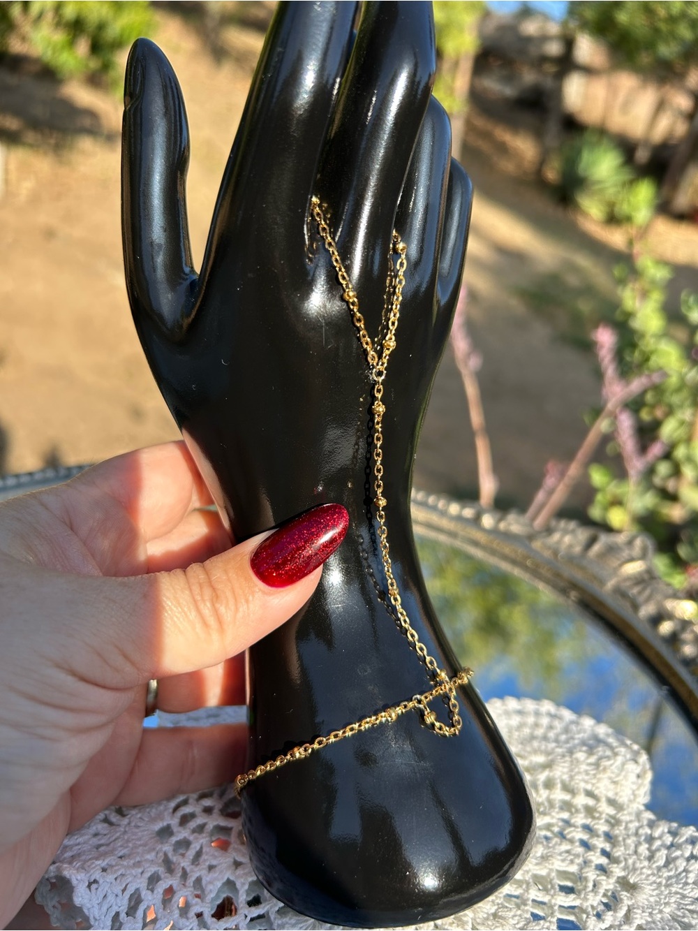 Gold tone hand chain